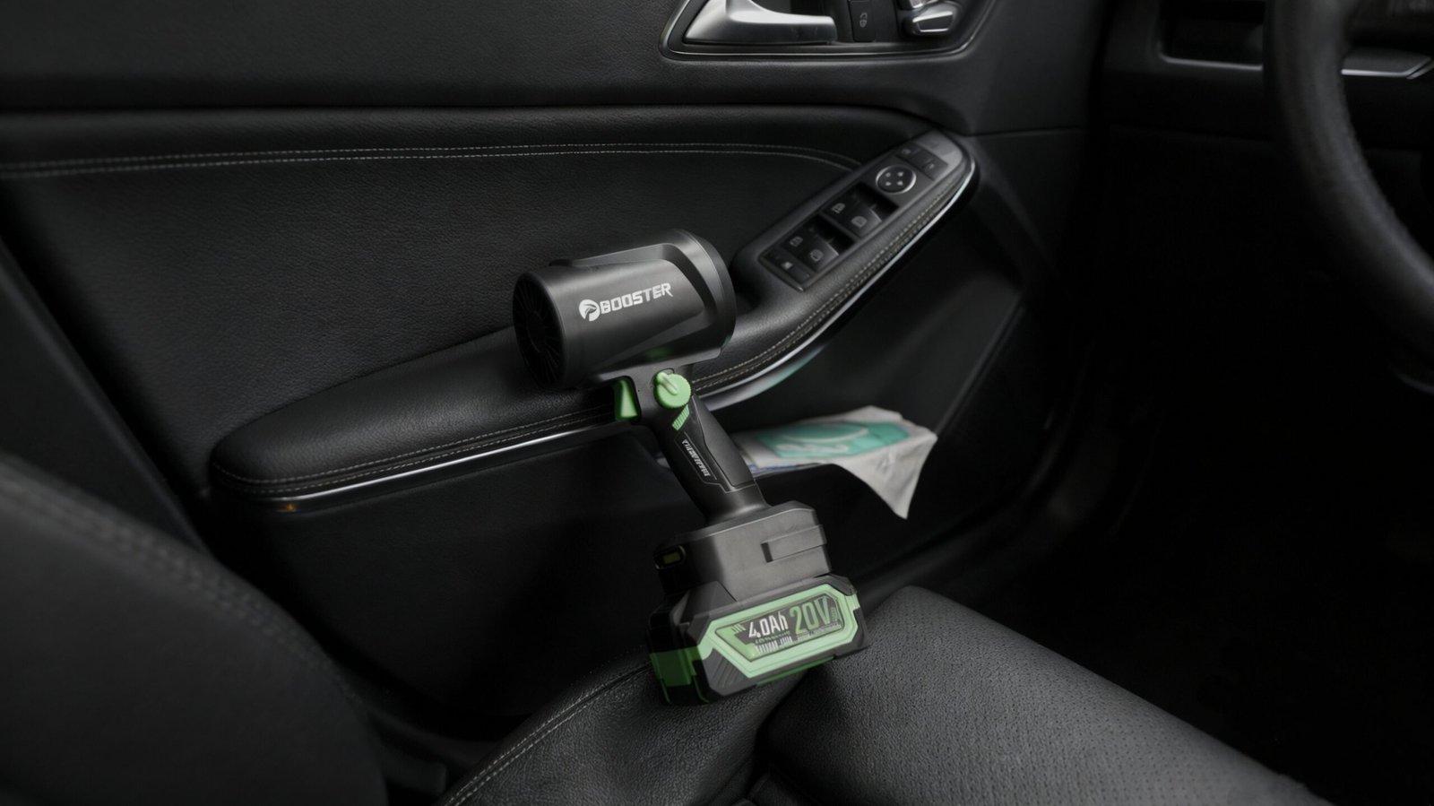 Booster TF64C car dryer blower, a complete full-body view placed on the car seat.