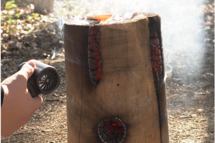 Booster TF40 is lighting a fire on the wooden stake.