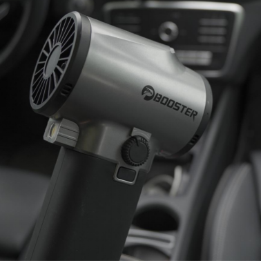 Booster cordless leaf blower, in a car interior scene, demonstrates its portable design, applicable for dust removal and cleaning inside the car, a multi-functional handheld turbine device.